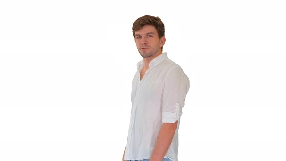 Casual Young Man Looking at Camera and Talking About Something on White Background