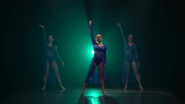 Three Gorgeous Professional Ballerinas Are Dancing Elements of Modern Ballet