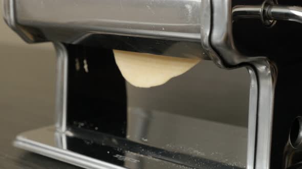 Manual pasta machine using at home close-up 4K 2160p 30fps UltraHD footage - Making of Italian lasag