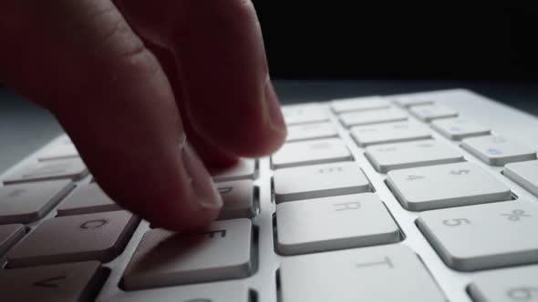 Closeup Typing on Keyboard with Man Fingers