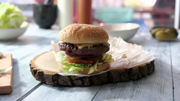 Burger on Wooden Board.