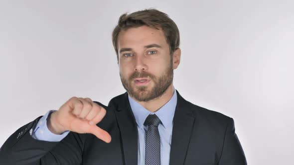 Portrait of Businessman Gesturing Thumbs Down