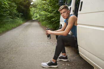 Runner sitting in van