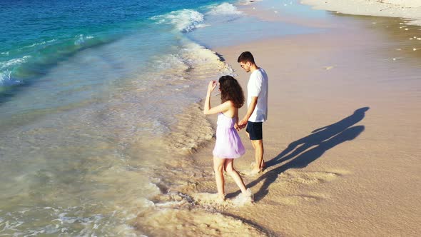 Romantic Boy and Girl Married on Vacation Live the Dream on Beach on Paradise White Sand