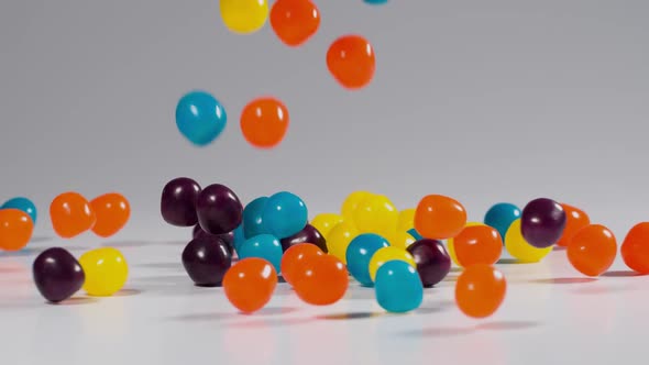 Colorful candy falls in slow motion