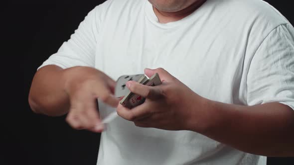 Man Showing His Trick With Usual Cards, Cardistry On Black Background