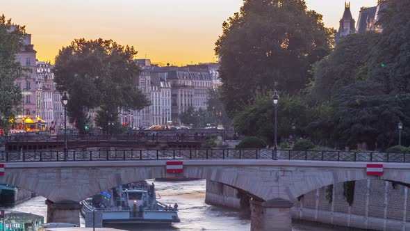 River and Bridge Near Notre Dame De Paris Cathedral Day to Night Timelapse After Sunset