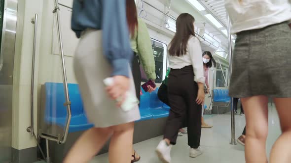 Crowd of People Wearing Face Mask on a Crowded Public Subway Train Travel