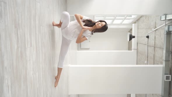 Beautiful Happy Pregnant Woman Exercising in Studio