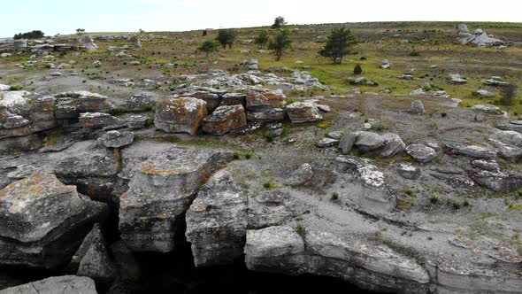 Drone flying above Rauk landform in Asunden Nature Reserve, Gotland