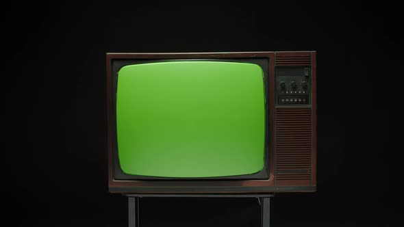 Old Retro Television with Antenna on Grey Background