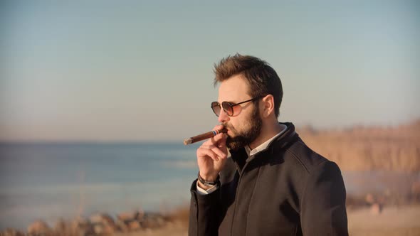 Businessman Leisure After Hard Working Day.  Man Relaxing On Autumn Park And Smoking.