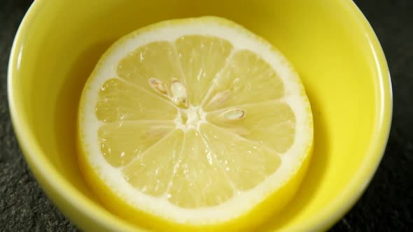 Slice of sweet lime in bowl 4k