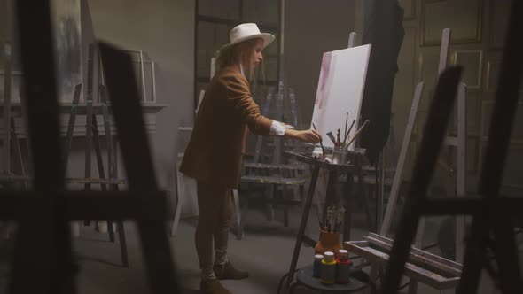 Female Artist Painting With Big Strokes