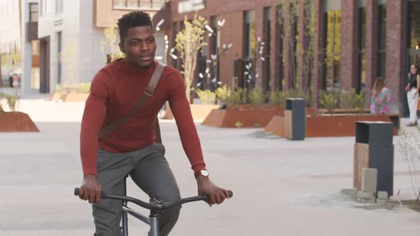 African American Man Riding Bike Outdoors