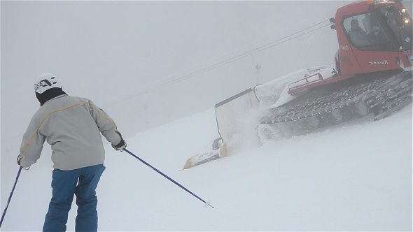 Snowcat and Skiers On Slope 1