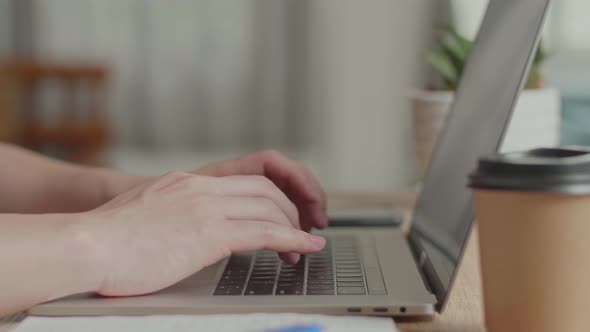 Hands Typing On Computer Keyboard Of A Laptop Computer