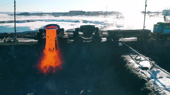 Wagon Tanks are Discharging Molten Metal Onto the Ground