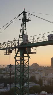 Construction Crane in the City at Sunrise