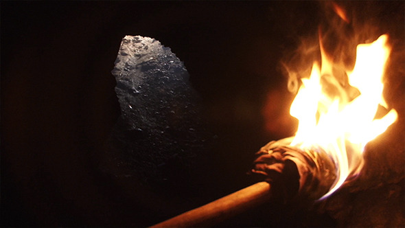 Burning Torch In Cave