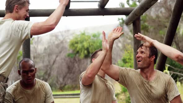 Military troops relaxing during obstacle course 4k