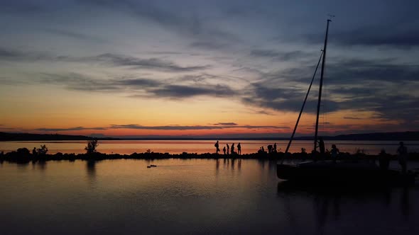 Boat going through at lake Balaton in the sunset.