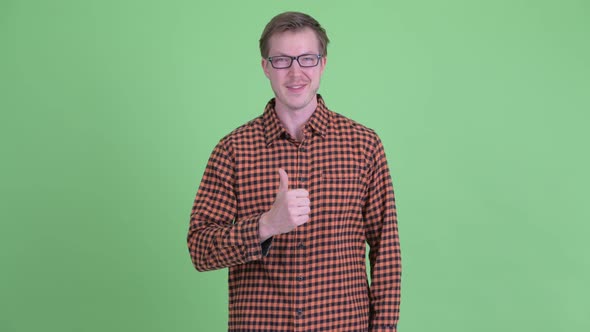 Happy Young Hipster Man Giving Thumbs Up