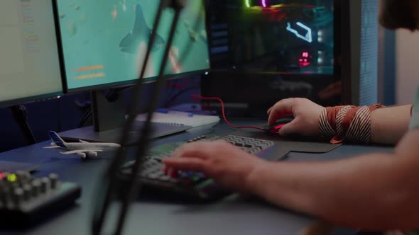 Close Up of Player Hands Using RGB Keyboard in Gaming Home Studio