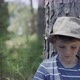 Boy leaning against tree trunk, portrait - VideoHive Item for Sale