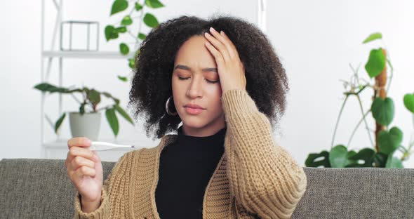 Portrait of Serious Mixed Race African American Ethnic Woman Girl Sitting Alone at Home in Living