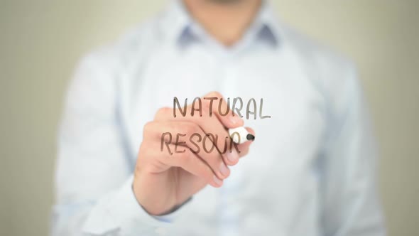 Natural Resources, Businessman Writing on Transparent Screen