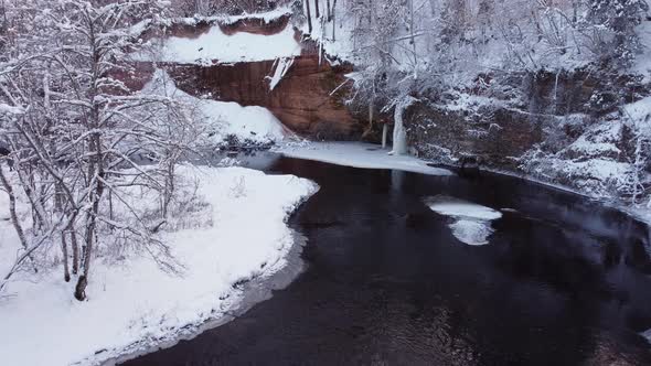 Beauty of sand cliff and frozen forest