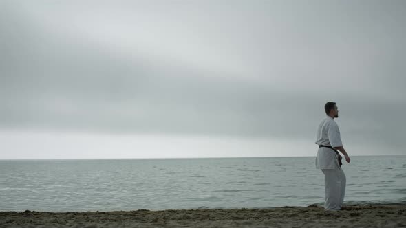 Fit Athlete Workout Kungfu on Sandy Beach