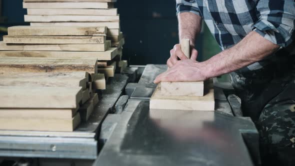 Closeup of Hands and Wood Workpiece on Planer