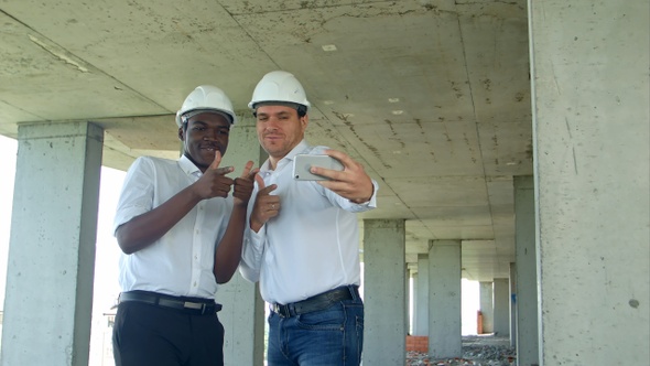 Team of builders happy smiling take selfie photo during