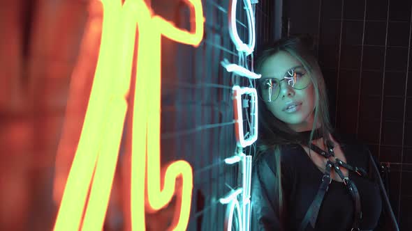 Portrait of a Beautiful Fashionable 20s Girl Wearing Glasses Looking at Camera and Smiling