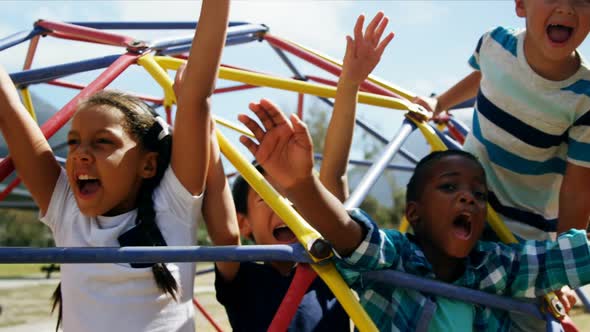 Happy schoolkids playing in playground