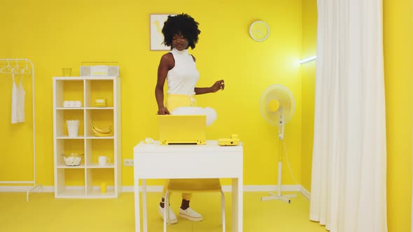 Black Stylish Lady Is Cleaning Yellow Room