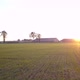 Aerial Cinematic Clip Drone Flying Over a Farm Field During Sunset - VideoHive Item for Sale