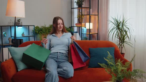 Happy Young Woman Shopaholic Consumer Came Back Home After Online Shopping Sale with Bags at Home