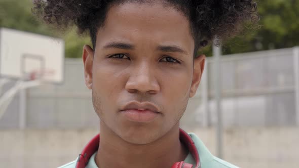 Closeup of a Teenager Looking at the Camera with Serious Face