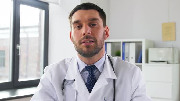 Doctor with Mask Having Video Conference at Clinic