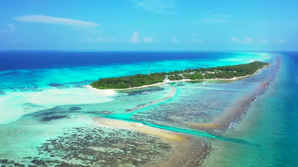 Aerial flying over scenery of tropical resort beach holiday by shallow lagoon with clean sand backgr