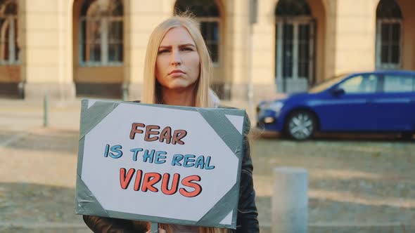 Blonde Woman Protesting That Fear is the Real Virus on Protest March