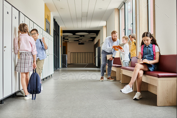 Hallway gathering: kids by lockers