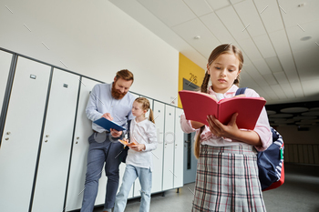 Gathering by the lockers: students and teacher in discussion