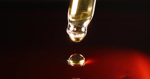 Clear Yelloworange Liquid is Dripping From Pipette  Movie