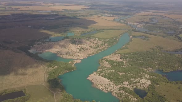 Wide Open Landscape With Career Lakes And Fields Flat Color