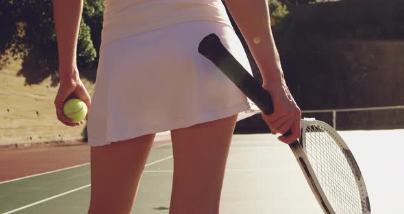 Woman playing tennis on a sunny day