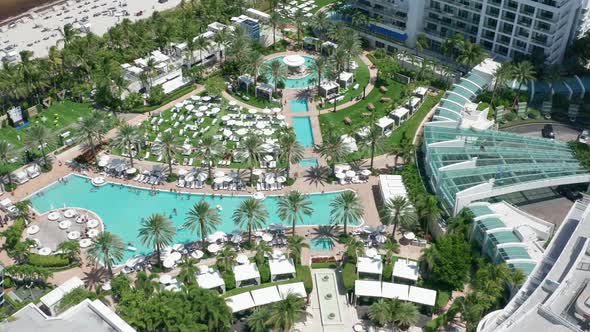 People Relaxing at Pool on Luxury Resort Property